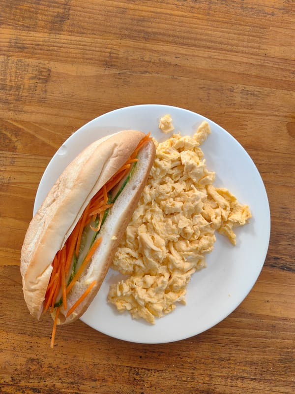 Person takes selfie, rests in bed in Vietnam