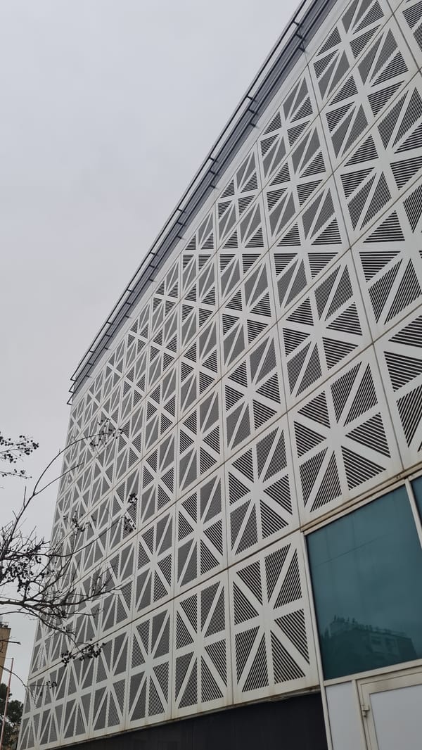 Woman photographed near distinctive architecture in Nahariyya, Israel