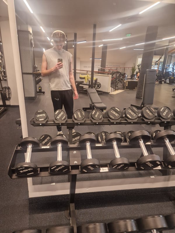 Person spotted in gym mirror reflection
