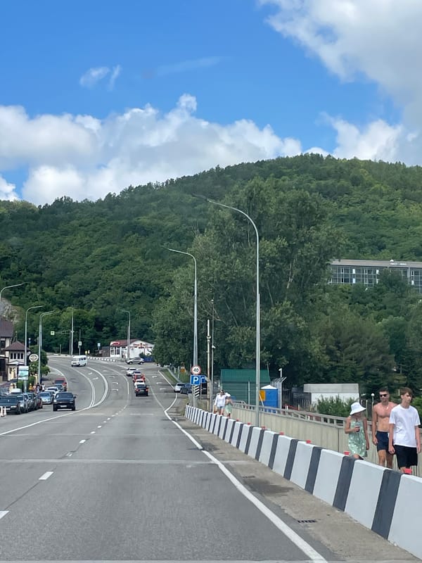 Morning drive through Nebug past church, highway, and hotel
