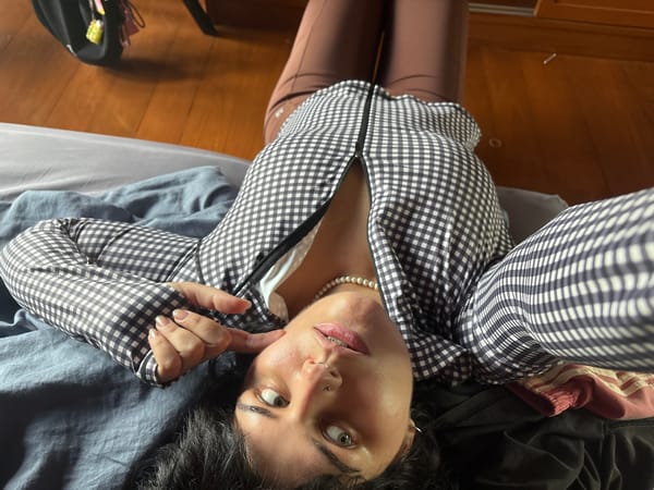 Morning at a Thai residence: selfies, a spirit house, and garden light