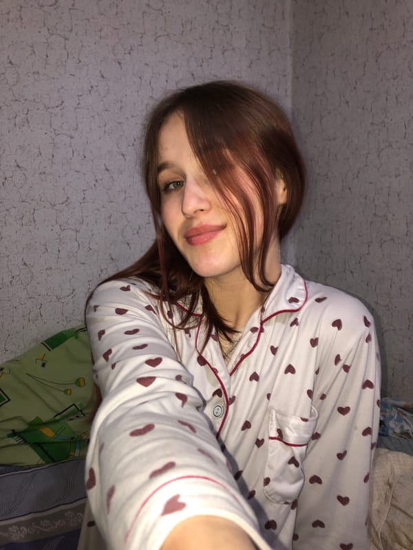 Woman and child share quiet moment on bed in Russia
