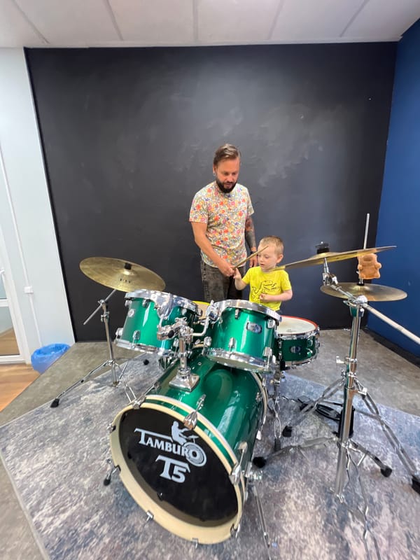 Child takes multi-instrument music lesson in Russian studio