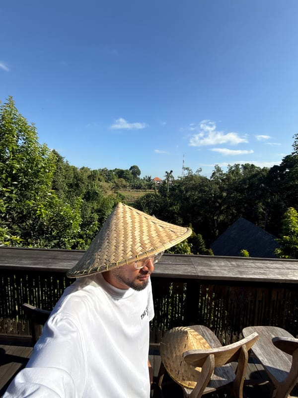 Man in traditional hat spotted on wooden deck in Kediri