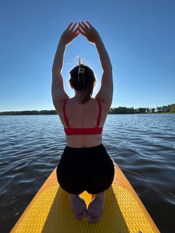Sunny afternoon paddleboarding on a lake near Chaykovsky