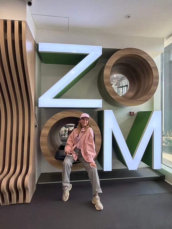 Woman poses with interactive letter art at Saint Petersburg hotel