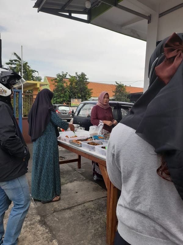 Street food vendors serve late-night customers in Sumorame