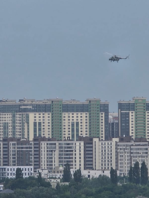 Military helicopter over Kyiv residential neighborhoods
