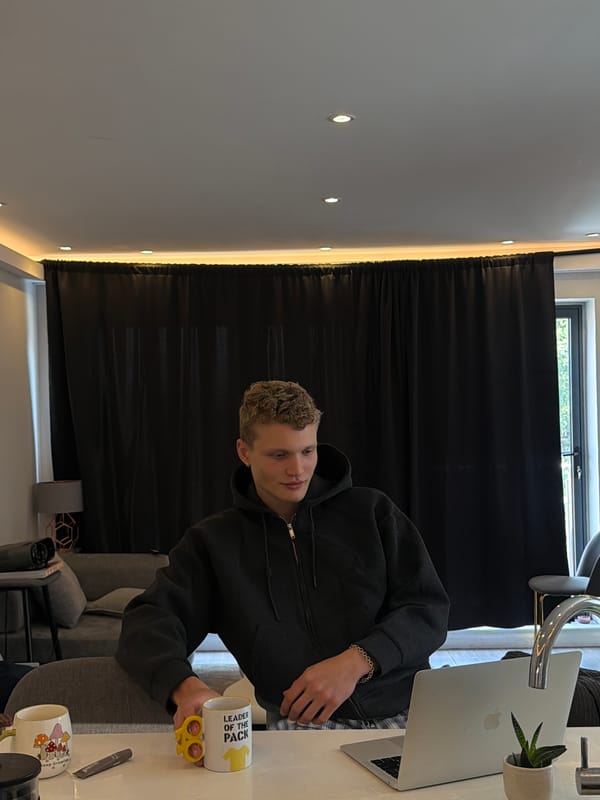 Young man works at laptop in London cafe