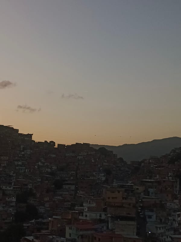 Caracas at sunset, hillside barrios and apartment windows