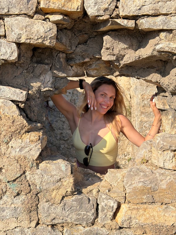 Woman performs yoga at historic Budva Citadel walls