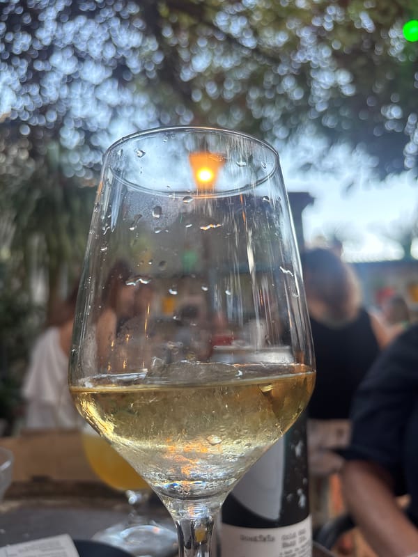 A relaxed summer evening at a courtyard café in Palafrugell