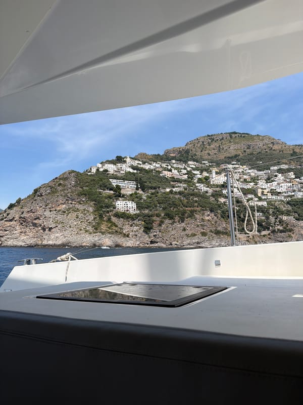 Boat passenger documents scenic views of Praiano coastline