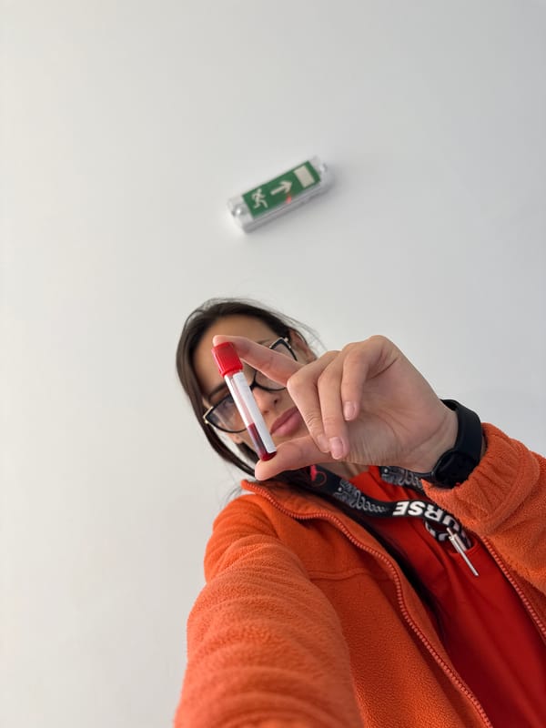 Healthcare worker handles blood sample, poses in Pleven facility