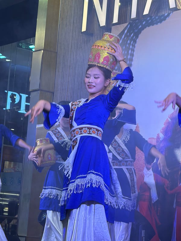 Traditional Vietnamese dance performance with golden vases, Nha Trang stage
