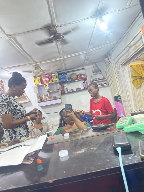 Hair salon operations documented in Abuja during evening hours