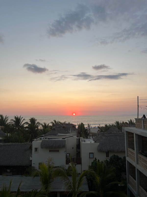 Sunset rooftop DJ party overlooks ocean in Brisas de Zicatela