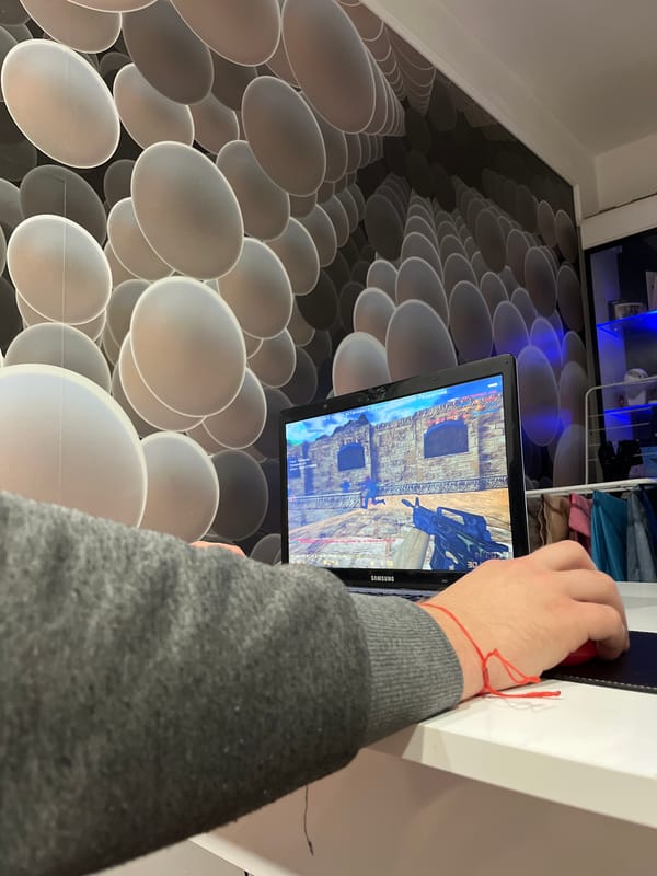 Person plays mobile shooter game on tablet in Varna