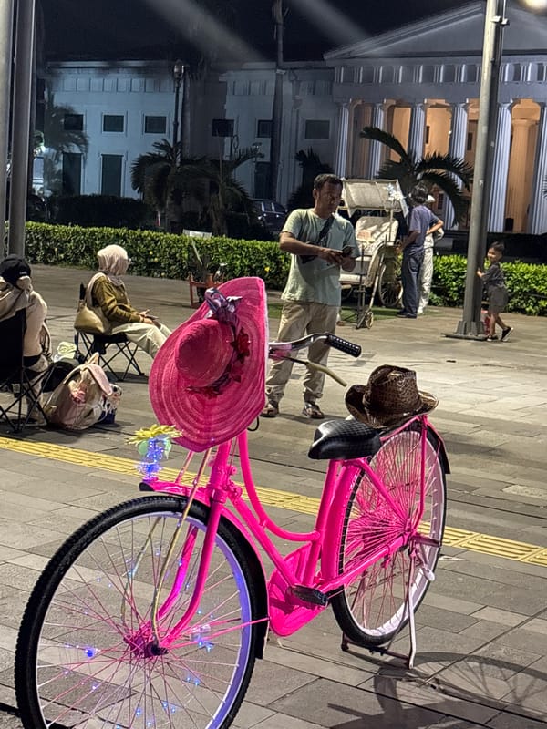 Night market activity unfolds around Jakarta's historic Kota district