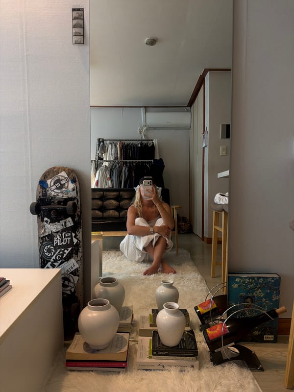 Woman takes mirror selfies in Seoul bedroom early morning