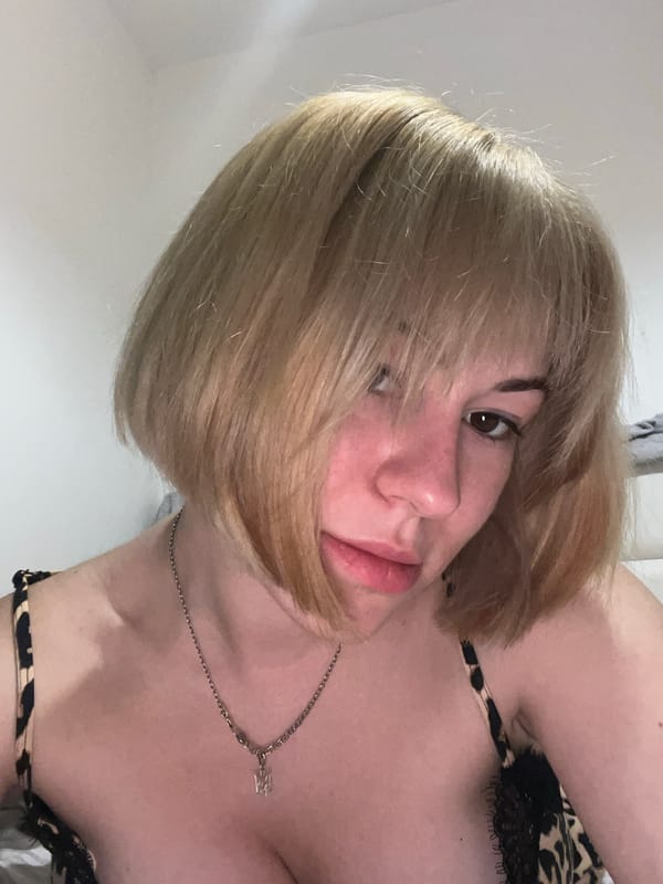 Woman photographed in bedroom setting in Boreti, Montenegro