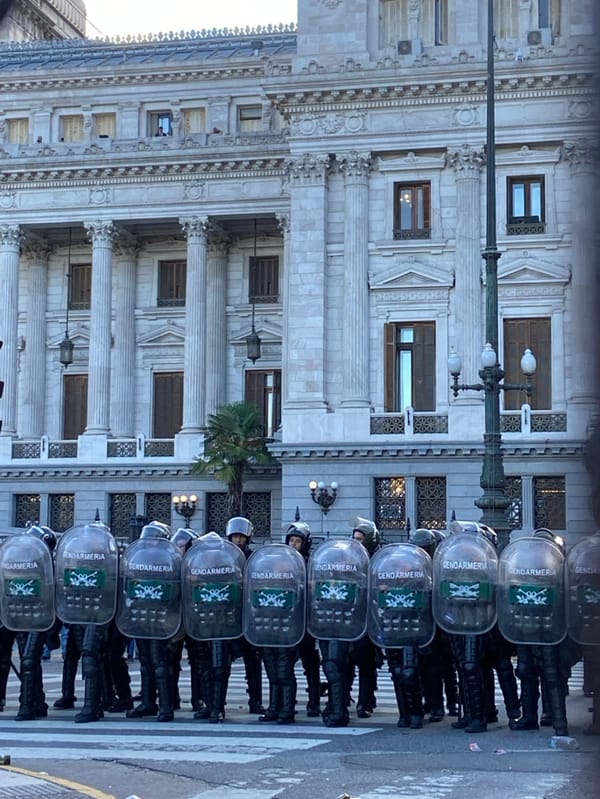 Buenos Aires protesters face riot police during labor reform demonstration