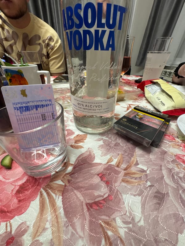 Informal gathering documented with vodka, glassware in Topoli, Bulgaria