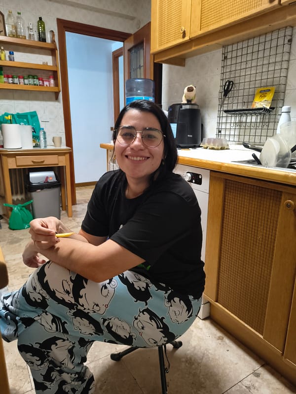Woman photographed smiling with yellow object in Guadalajara kitchen
