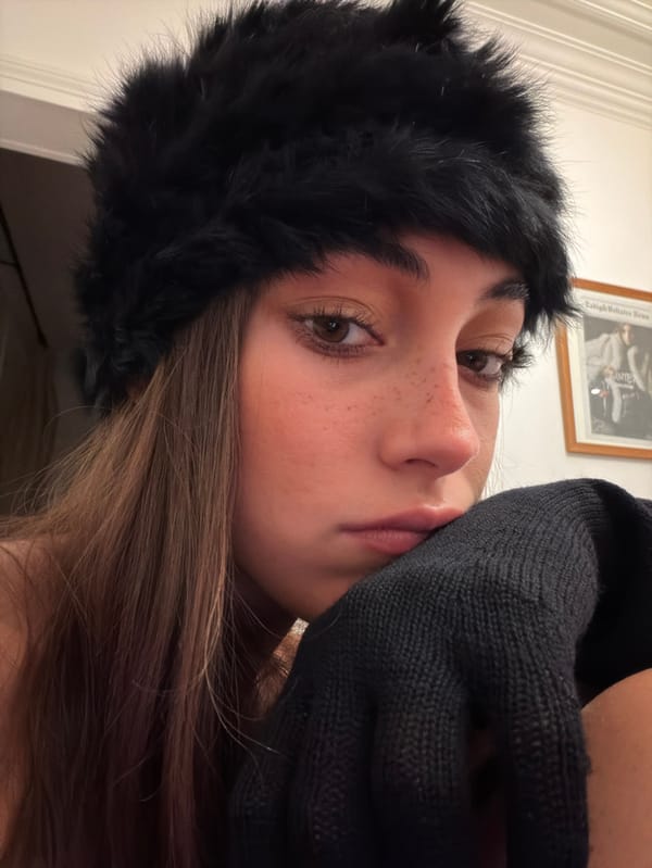 Woman in black fur hat photographed in Paris
