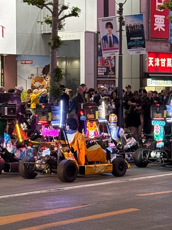 Custom vehicle parade draws crowds in nighttime Shibuya streets