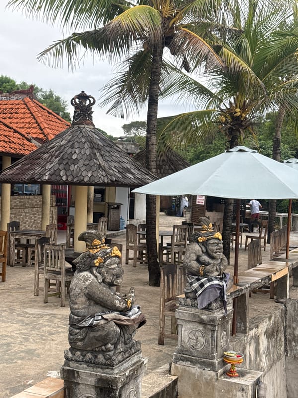 Stone statues with traditional decorations observed in Kuta Selatan