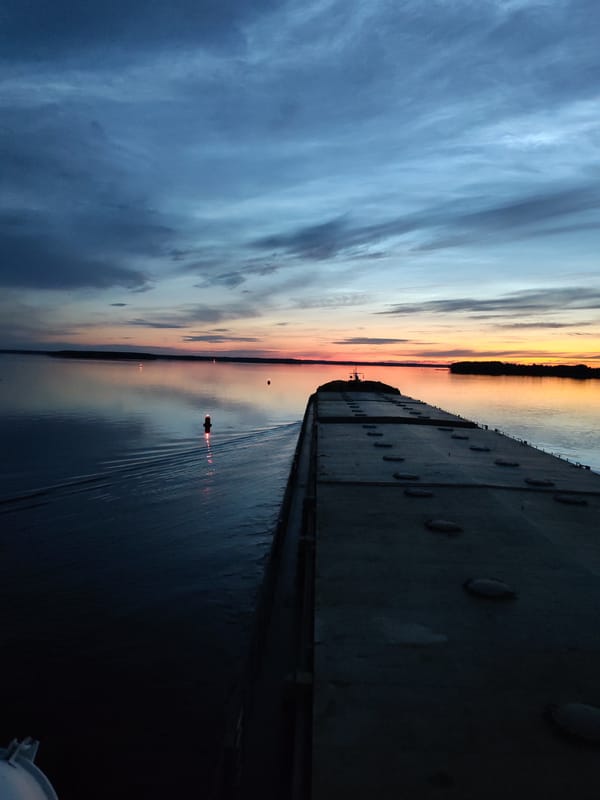 Sunset to moonrise on the Sheksna River, barge in frame