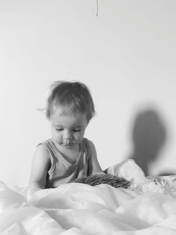 Child photographed in bedroom during early morning hours