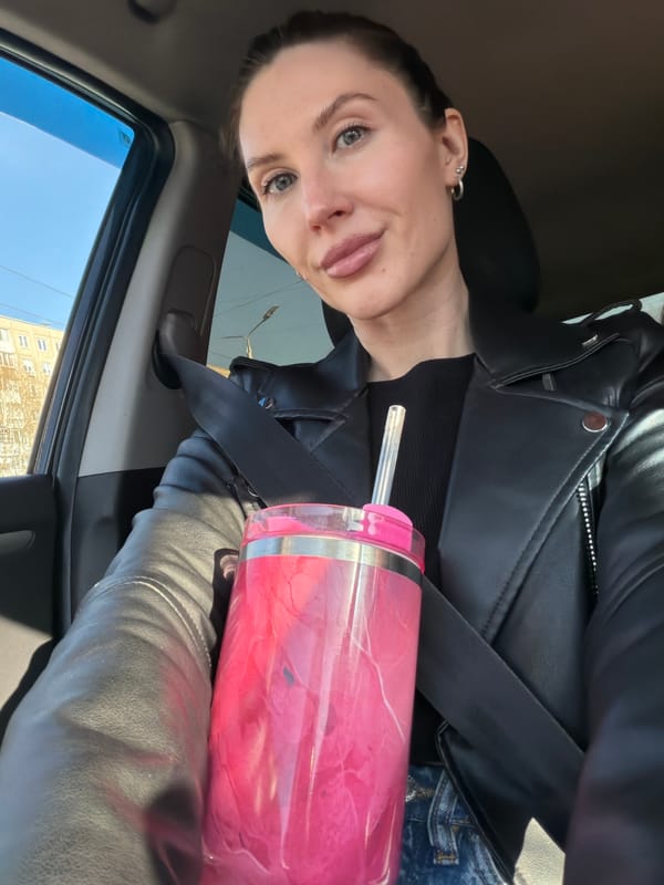 Driver secures pink tumbler with seatbelt in Perm