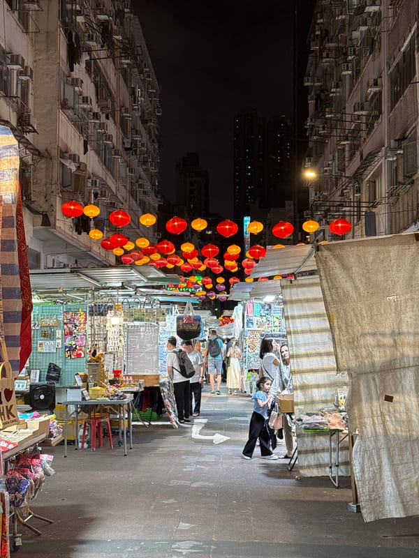 Traditional night market bustles under lanterns in Hong Kong