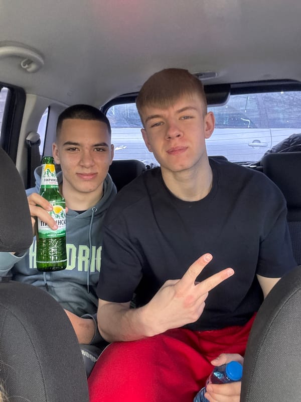 Young people pose for photos inside car in Bulgaria