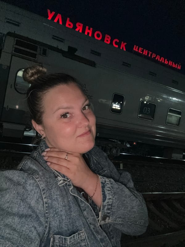 Woman photographs theatrical train exhibition at Ulyanovsk station
