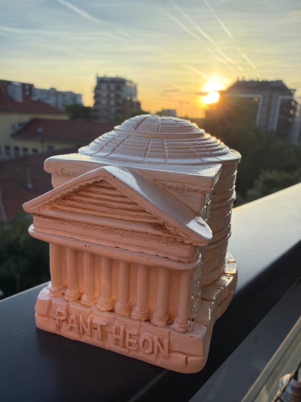 Witness documents miniature still-life arrangements against urban sunset backdrop