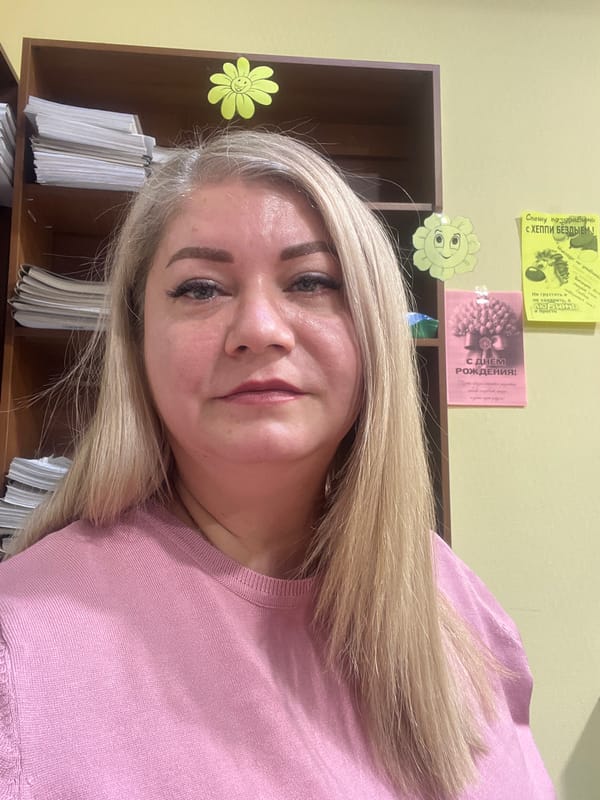 Woman photographed in office setting during early morning hours