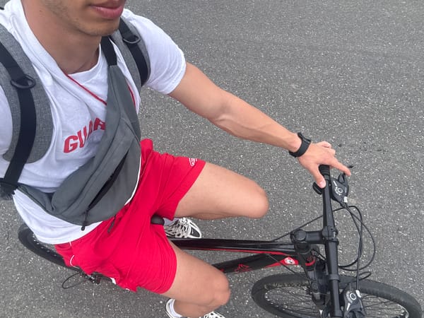 Cyclist down on asphalt following gym workout session