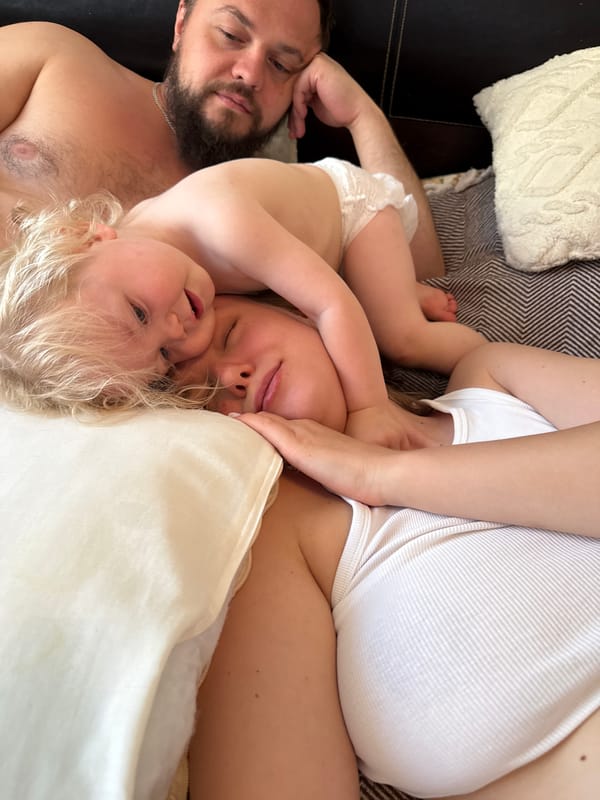 Family rests together at home in Vladimir, baby in tow