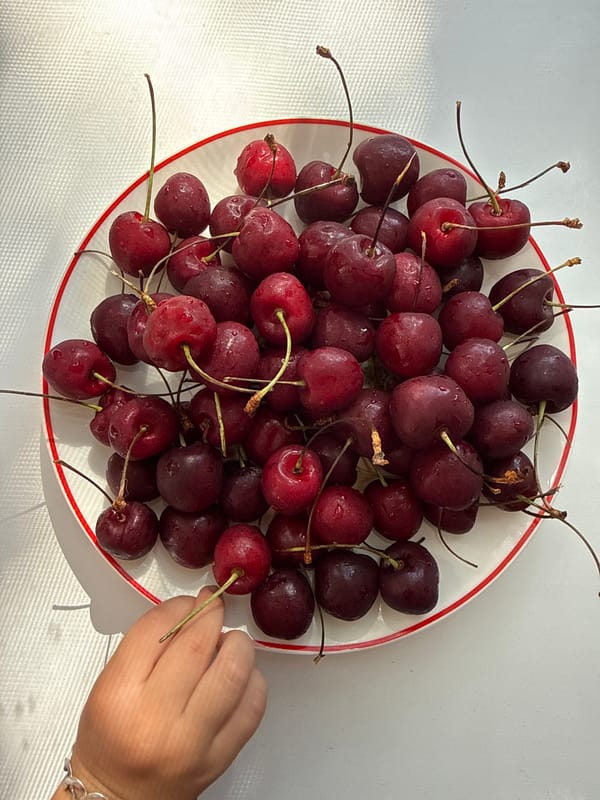 Fresh cherries by a window on a summer afternoon in Rusanovo