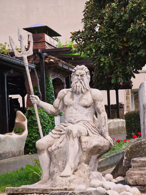 Neptune statue observed in garden setting in Obzor, Bulgaria