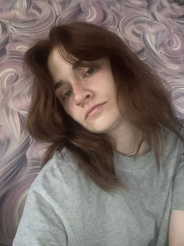 Person rests on bed in Chaikovsky, Russia early morning