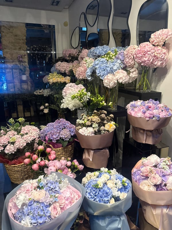 Paris flower shop displays various bouquet arrangements