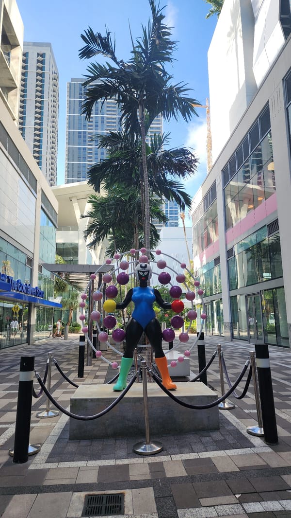 Modern suspended female figure sculpture spotted on Miami street