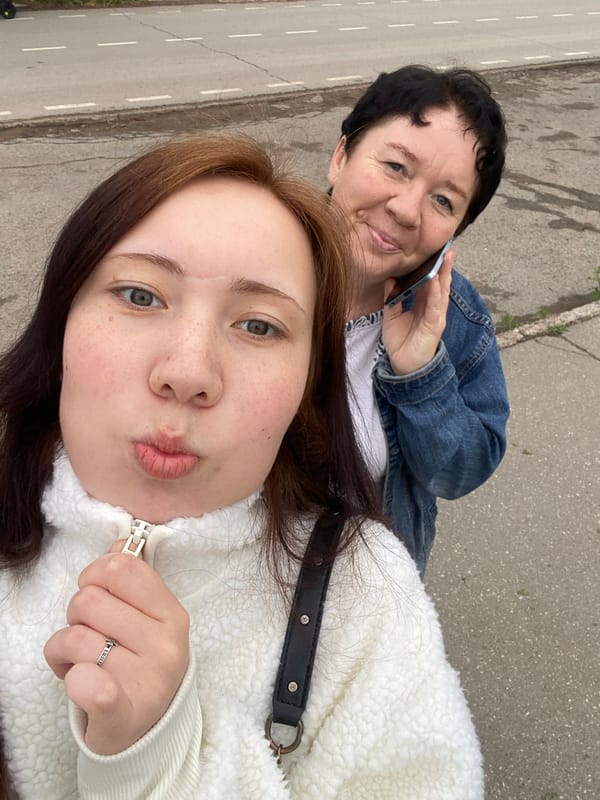 Two women share casual outdoor moments, peaches spotted nearby