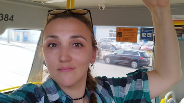 Midday transit and street life across central Saint Petersburg