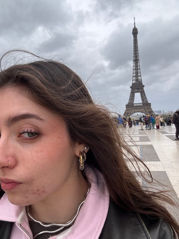 Tourist enjoys classic Paris café experience near Eiffel Tower