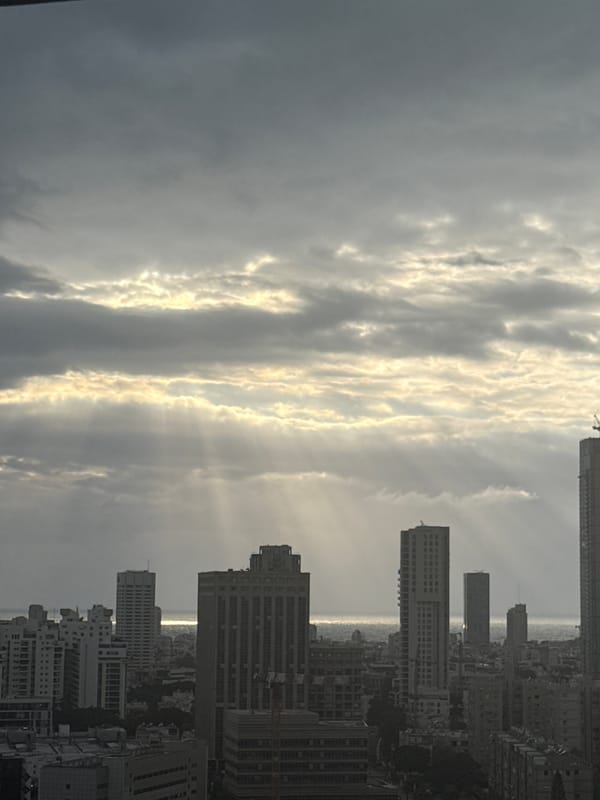 Tel Aviv cityscape photographed under dramatic skies